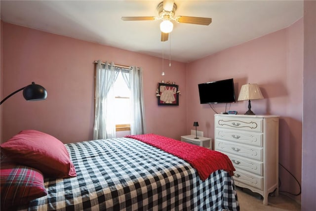 bedroom featuring light carpet and ceiling fan