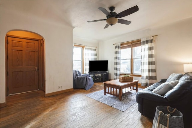 living room featuring hardwood / wood-style flooring and ceiling fan