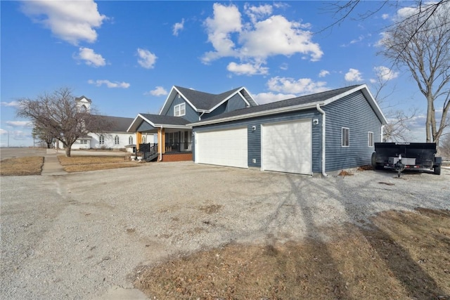 exterior space featuring a garage and covered porch