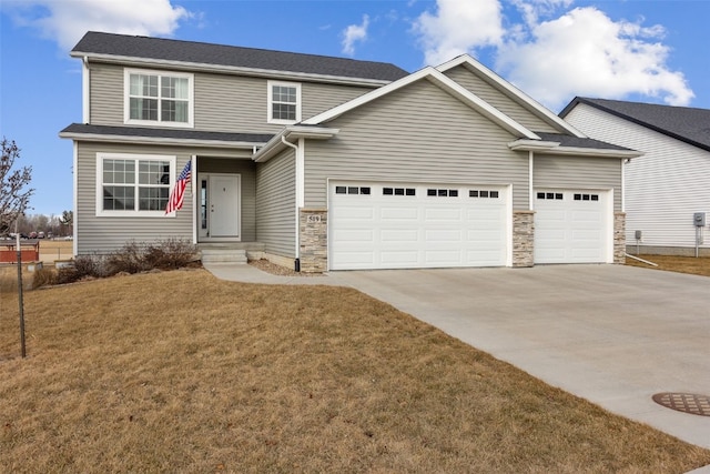 view of front facade with a garage and a front yard