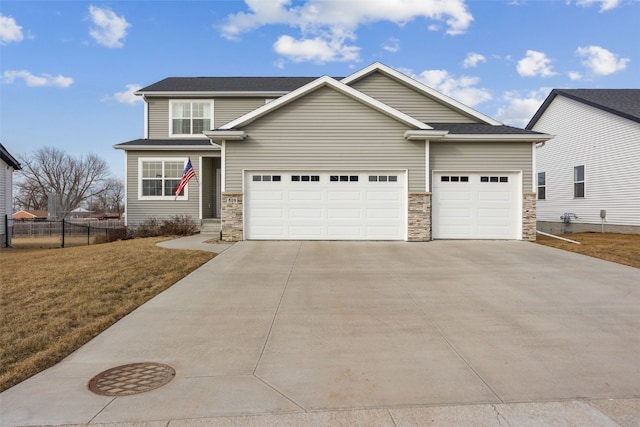 view of front of home with a garage and a front yard