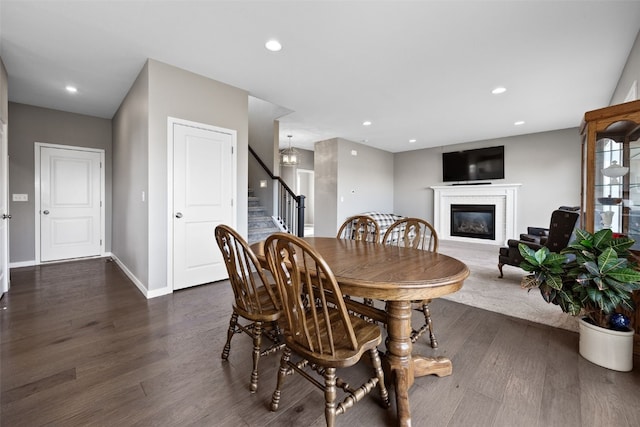 dining area featuring dark hardwood / wood-style floors