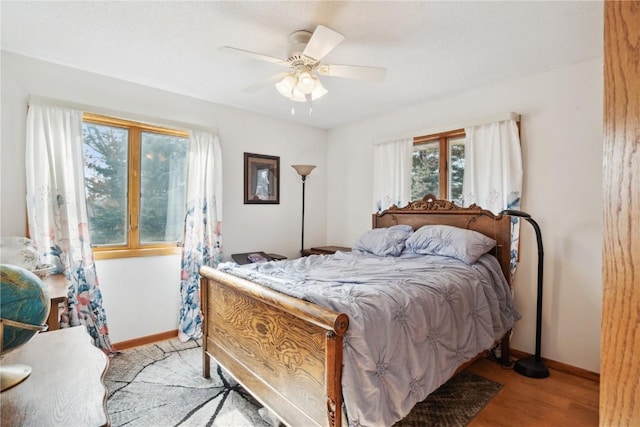 bedroom featuring ceiling fan and light hardwood / wood-style flooring