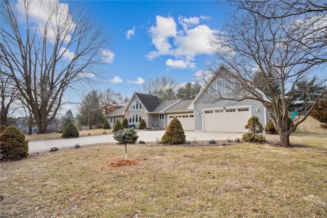 view of front of home with a garage and a front lawn