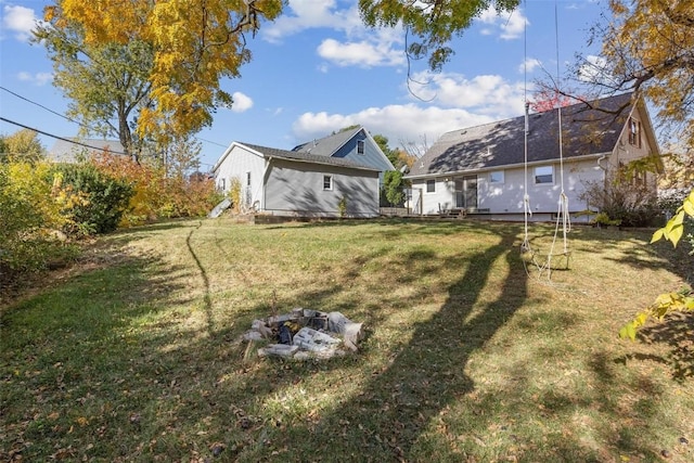 view of yard with a fire pit