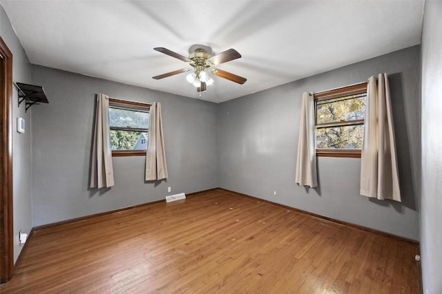 unfurnished room with ceiling fan and light hardwood / wood-style flooring