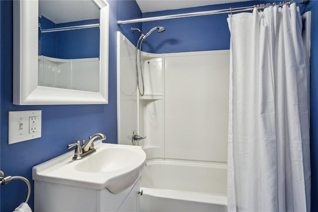 bathroom with shower / bath combo with shower curtain and vanity