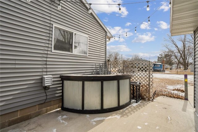 view of patio featuring fence