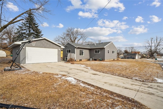 ranch-style house featuring a detached garage