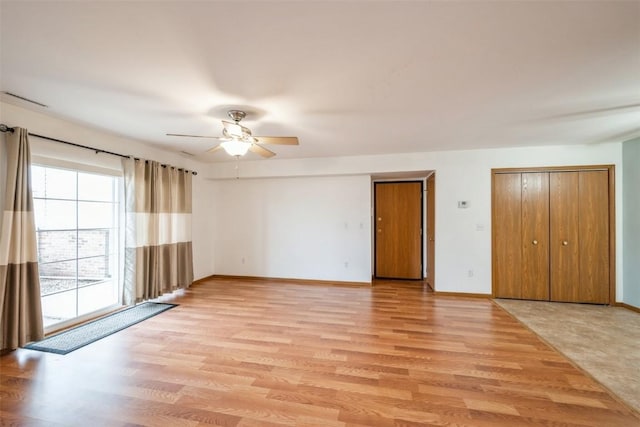 unfurnished room featuring ceiling fan and light hardwood / wood-style flooring