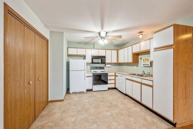 kitchen featuring ceiling fan, sink, white cabinets, and white appliances