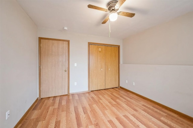 unfurnished bedroom featuring light hardwood / wood-style flooring and ceiling fan