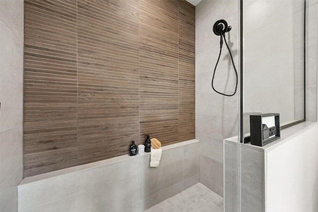 bathroom with tiled shower