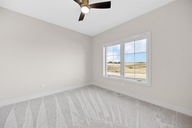 unfurnished room featuring carpet flooring and ceiling fan