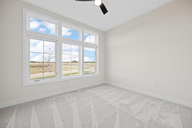 spare room with ceiling fan and carpet flooring