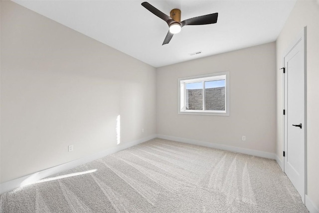 unfurnished room with ceiling fan and carpet floors