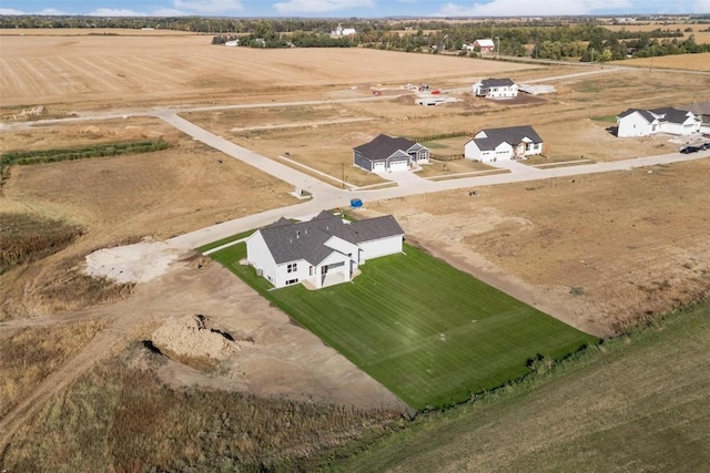 birds eye view of property with a rural view