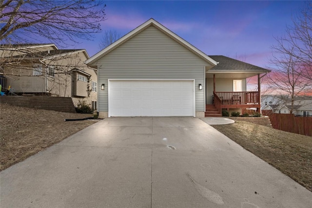 view of front of house with a garage and covered porch