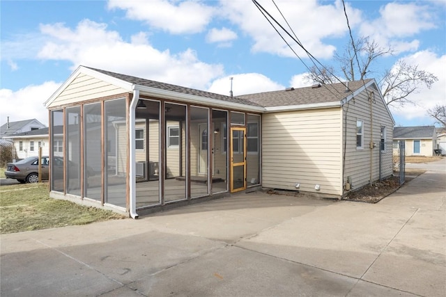 rear view of house with a sunroom