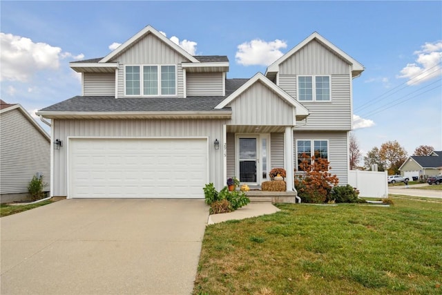 view of front facade featuring a garage and a front lawn