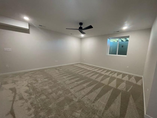 carpeted empty room featuring ceiling fan