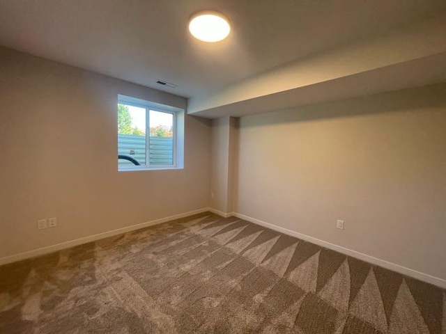 spare room featuring carpet floors