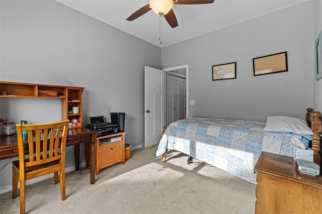 bedroom featuring light carpet and ceiling fan