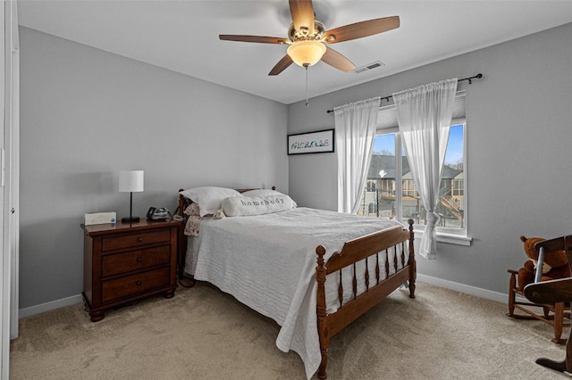 bedroom with light colored carpet and ceiling fan