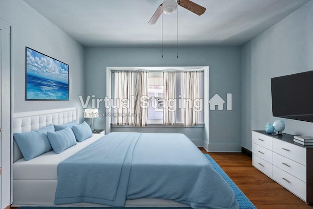 bedroom featuring dark wood-type flooring and ceiling fan