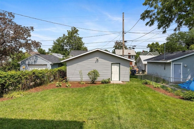 rear view of property with a lawn