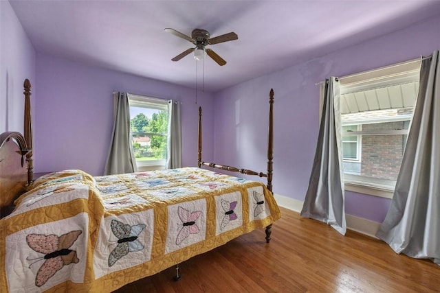 bedroom featuring wood-type flooring and ceiling fan