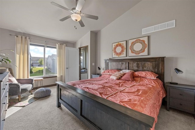 carpeted bedroom with vaulted ceiling and ceiling fan