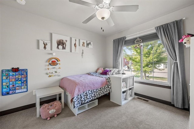 bedroom featuring light carpet and ceiling fan