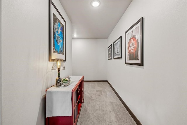 hallway with light colored carpet