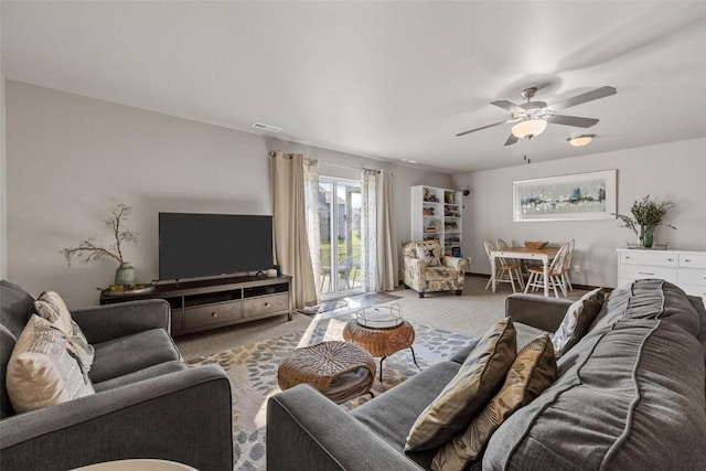 living room with ceiling fan and light carpet