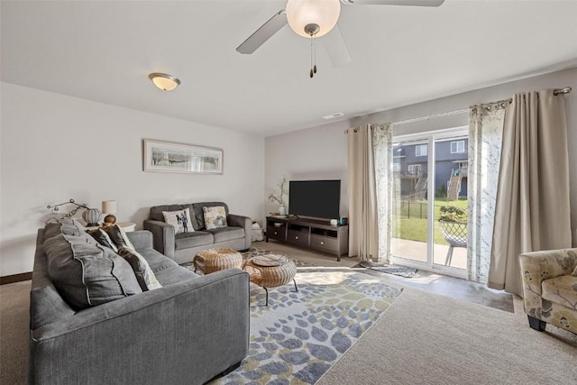 living room featuring ceiling fan and carpet