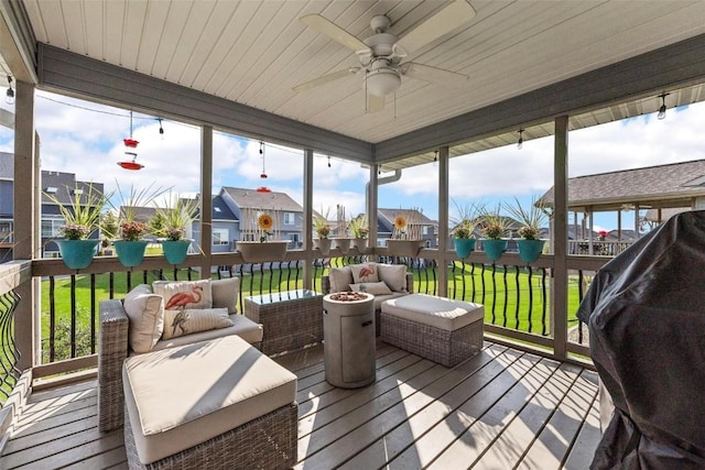 sunroom / solarium with ceiling fan