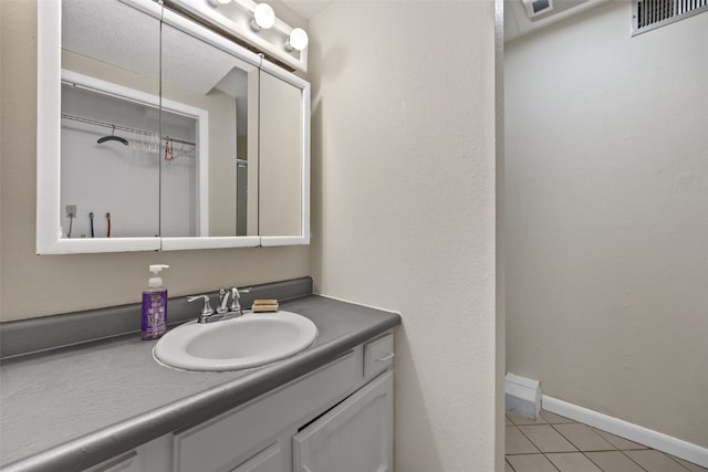 bathroom with vanity and tile patterned floors