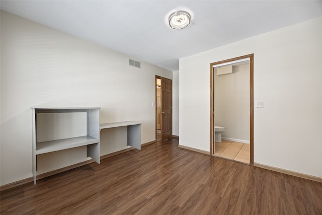 unfurnished bedroom with wood-type flooring