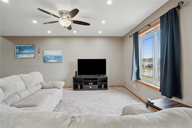 living room with light carpet and ceiling fan