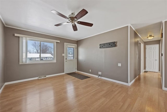 foyer featuring crown molding, ceiling fan, and light hardwood / wood-style flooring