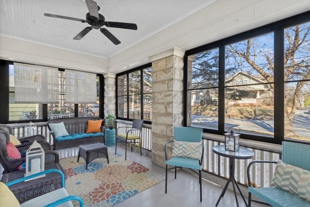 sunroom featuring ceiling fan