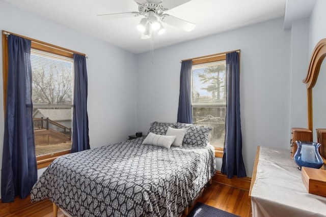 bedroom featuring dark hardwood / wood-style flooring and ceiling fan