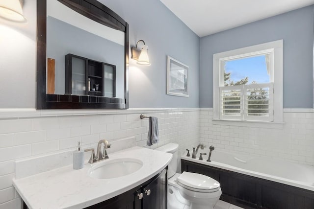 bathroom with vanity, a bath, tile walls, and toilet