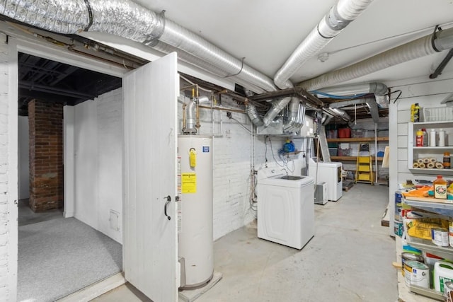 basement with independent washer and dryer, water heater, and brick wall