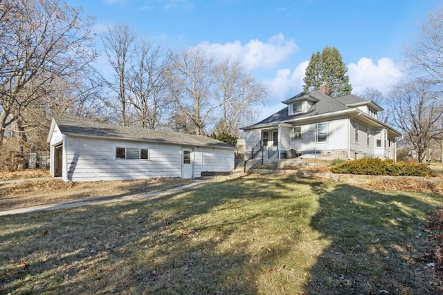 view of side of home with a yard and covered porch