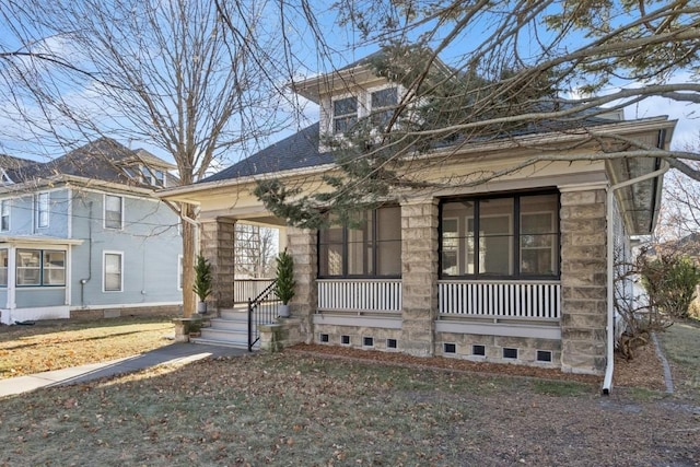 view of front of home with a front lawn and covered porch