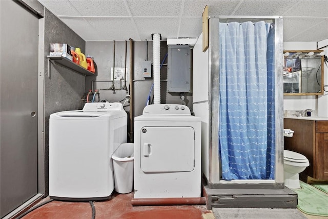 washroom featuring separate washer and dryer and electric panel