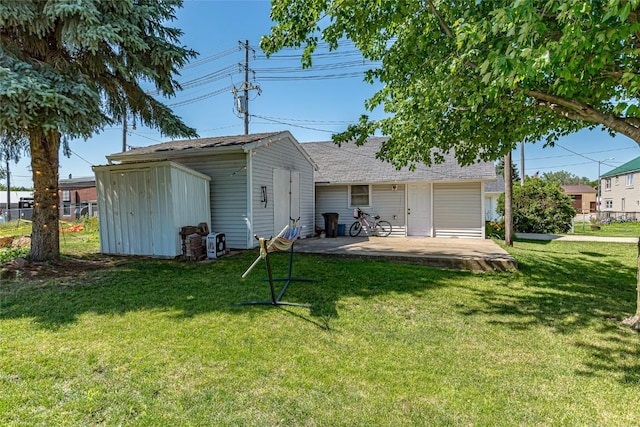 back of house featuring a yard and a patio area