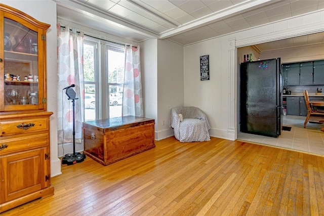 sitting room featuring light hardwood / wood-style flooring